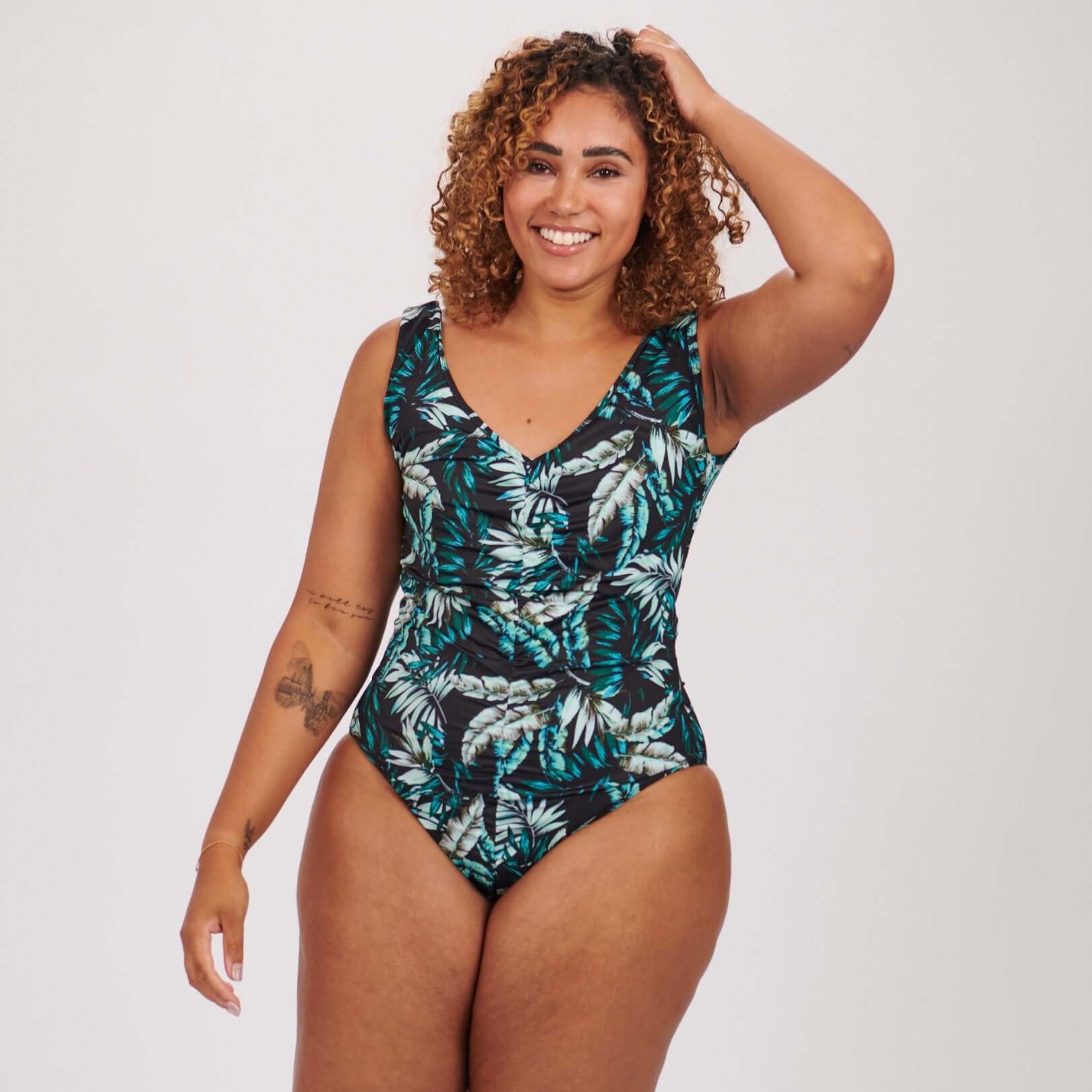 Jessica Womens Ostomy Swimsuit - Introducing Jessica Swimwear, a stylish and functional choice for ostomy women seeking comfort and confidence at the beach. This swimsuit features a flattering V-Neck cut, accentuated by a lightly gathered front for a touc